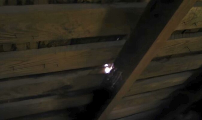 A light leaks through the attic roof
