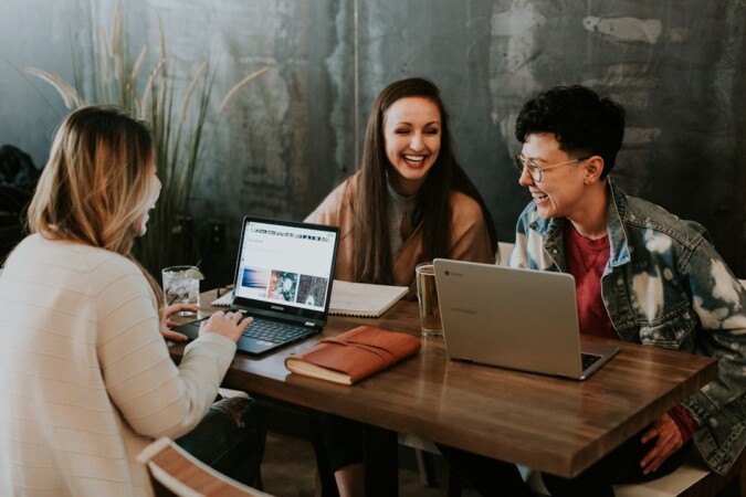 Team members collaborating in an office conference room, enhancing data security and compliance with enterprise fax solutions
