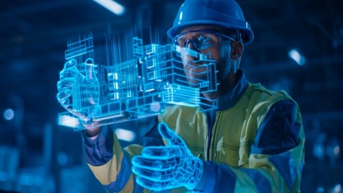 An engineer uses augmented digital models to analyze data and apply AI tools in an industrial setting