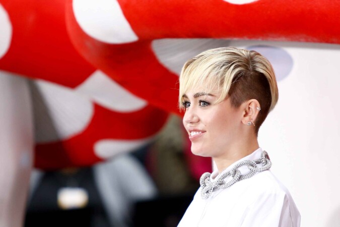 Miley Cyrus posing at an event