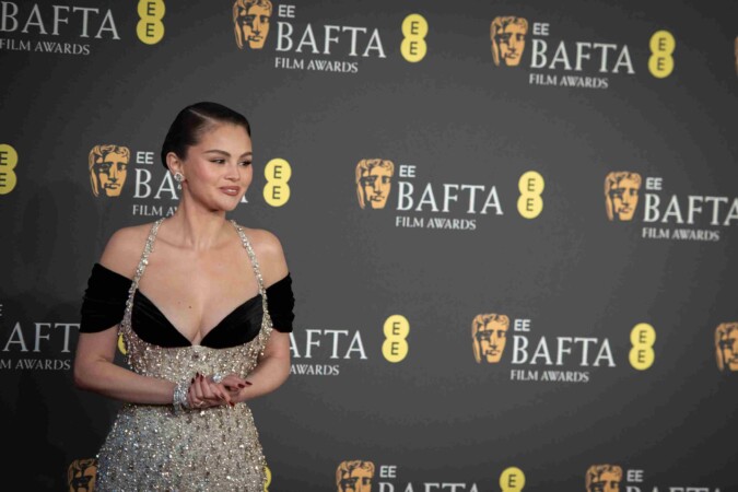 Selena Gomez posing on the red carpet at the BAFTA Film Awards