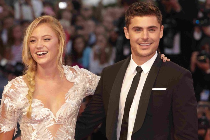 Zac Efron with another actor posing together on a red carpet